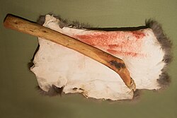 A scraper and ocher powder used to work leather. One of the many utilitarian applications of ocher includes its use in hide processing. Courtesy of the Alcoy Municipal Archaeological Museum.