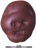 The Makapansgat cobble, a jasperite pebble transported to a cave in the Makapan Valley, South Africa, where it was deposited almost 3 million years ago. This pebble is a notable manuport, a possible example of early paleoart, and is the oldest known objects of its kind.